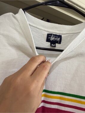 Stussy White Tee with Green, Yellow and Maroon Stripe Detail